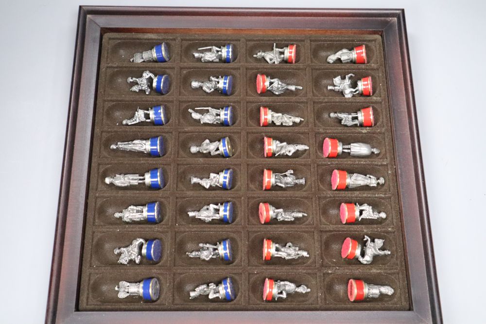 A boxed Battle of Waterloo chess set, with board to lid of box